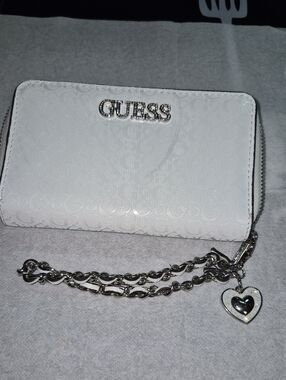GUESS White Embossed Logo Wristlet with Silver Chain and Heart Charm
